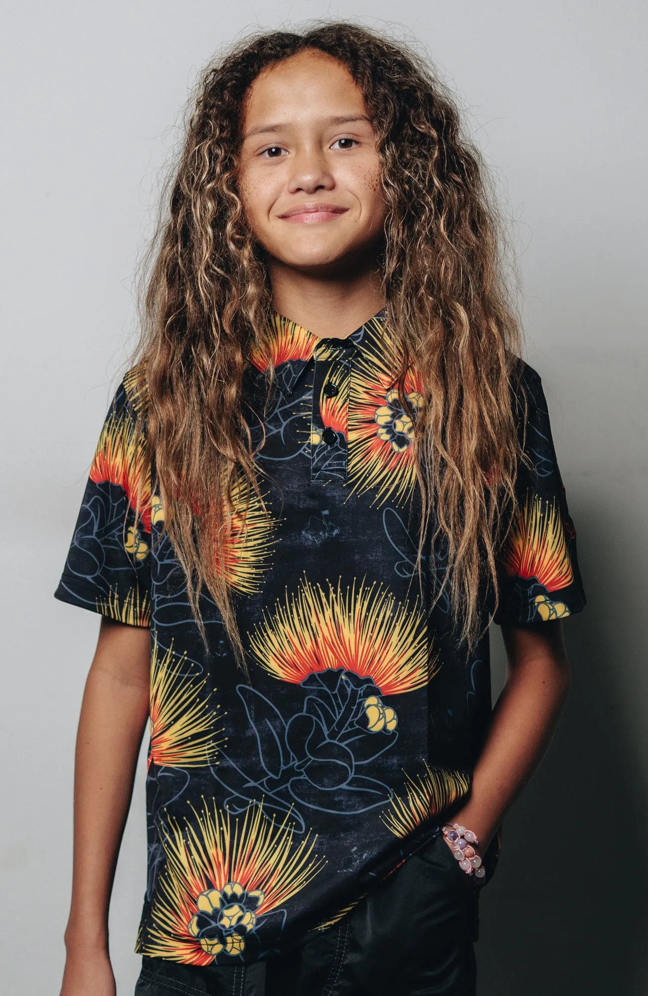 "Ohia Lehua" Amber Red - OGA Youth Polo - Black Amber