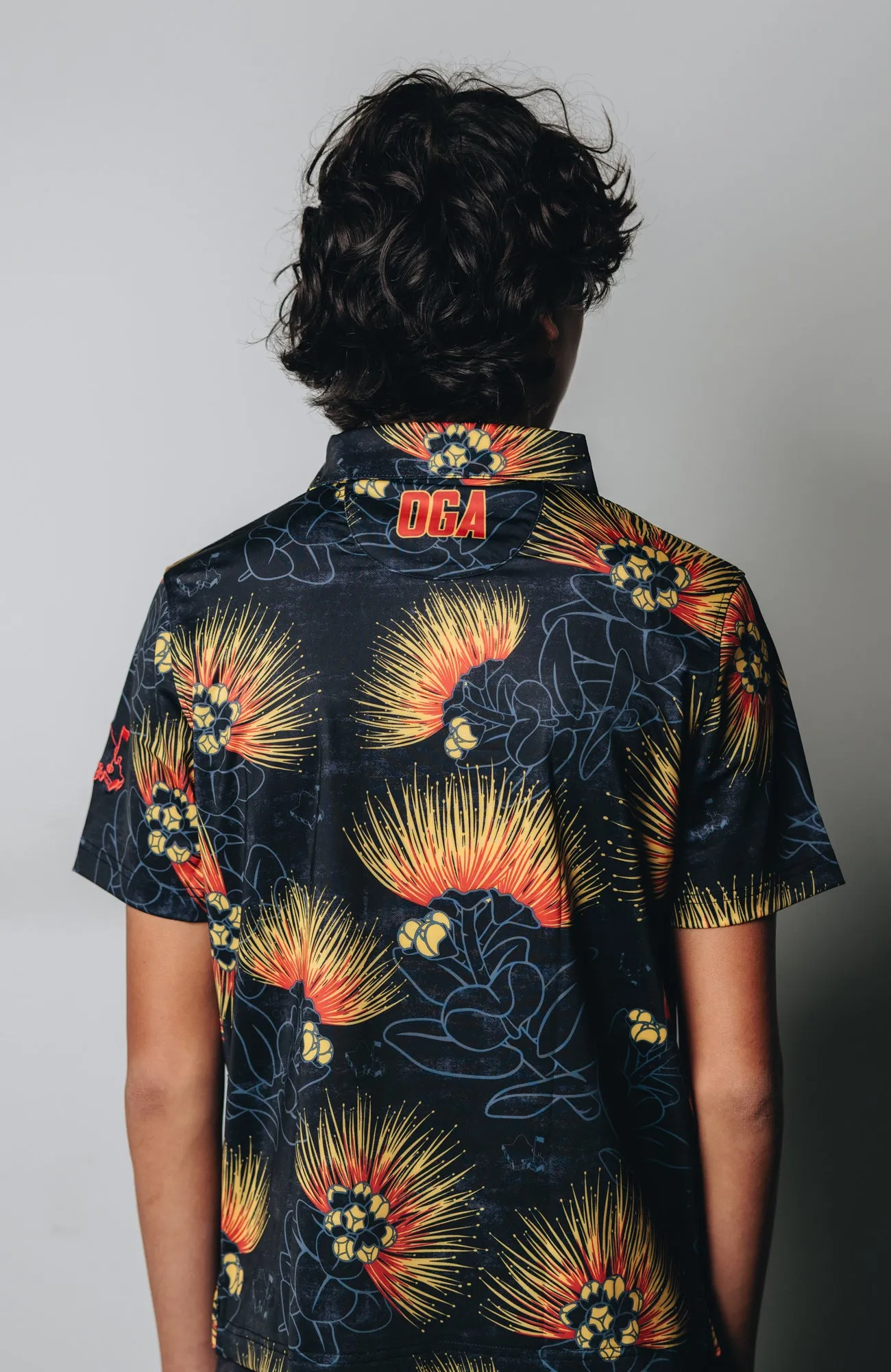 "Ohia Lehua" Amber Red - OGA Youth Polo - Black Amber